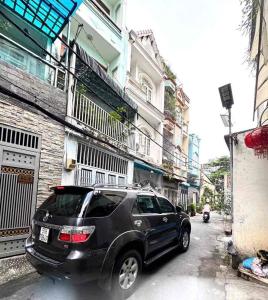 BÁN NHÀ HXH ĐƯỜNG HIỆP NHẤT, P4, TÂN BÌNH, XE HƠI NGỦ TRONG NHÀ, 4 TẦNG GIÁ 9.X TỶ.